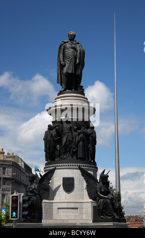 the daniel oconnell memorial statue at the end of oconnell street with the dublin spire in the background dublin city centre Stock Photo