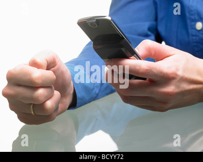 Hands of a woman, holding cellular phone Stock Photo