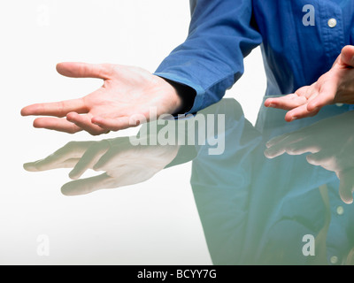 Hands of a woman on table Stock Photo