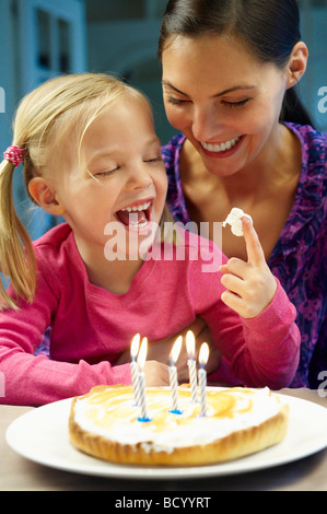 Mother and daughter celebrating birthday Stock Photo