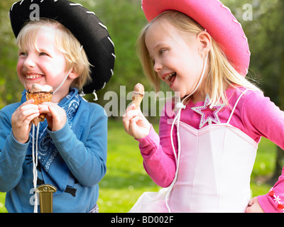 Kids with costume, eating ice-cream Stock Photo