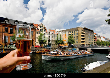 Cheers to the sightseeing boat in Christianshavn canal, Copenhagen, Denmark, Europe Stock Photo