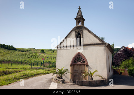 Orschwihr Haut Rhin Alsace France Europe. Small church and Grand Cru vineyards in wine growing region on the Alsatian wine route Stock Photo