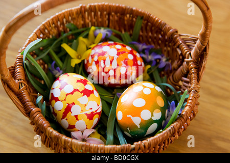 painted easter eggs in basket Stock Photo
