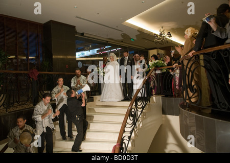 A Jordanian bride and groom on their way to a wedding ceremony in a hotel in Amman Jordan Stock Photo