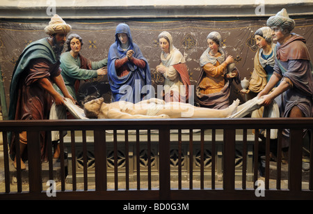 People gathered round the body of christ in Treguier church, Brittany Stock Photo