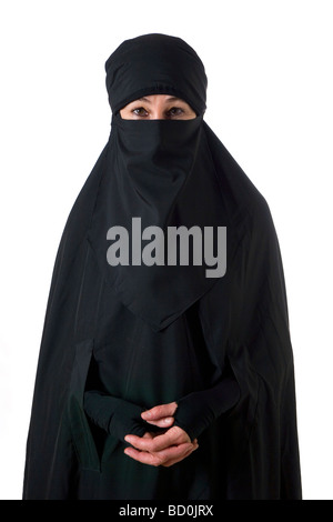 Islamic muslim woman wearing a burqa niqab burka and making a rude hand ...