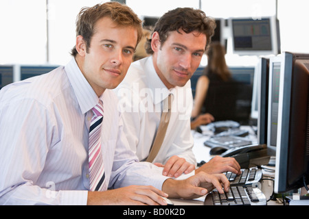 Colleagues Working Together At Computer Stock Photo