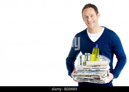Man Carrying Stack Of Recycling Stock Photo