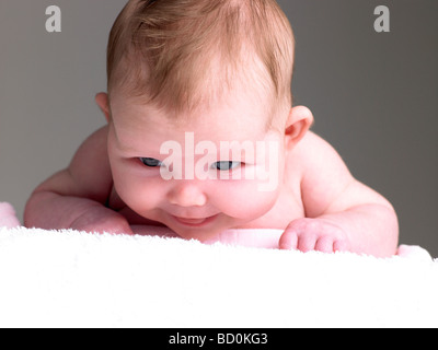 Newborn Baby Girl On Towel Stock Photo