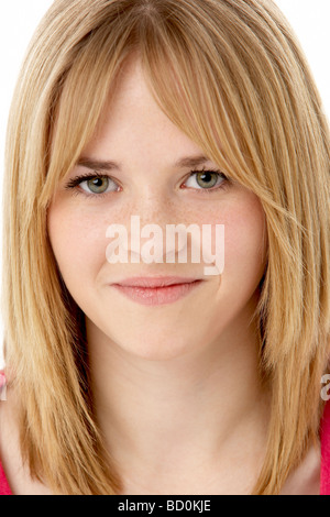 Studio Portrait Of Smiling Teenage Girl