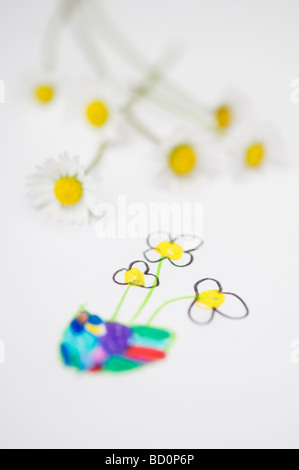 Daisy flowers with a child's drawing of flowers Stock Photo