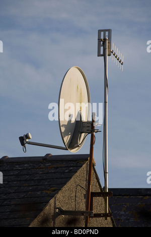 Television aerials on rooftop Stock Photo