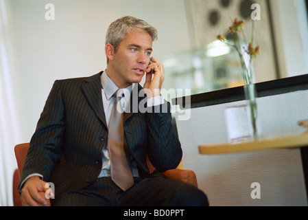 Businessman talking on cell phone Stock Photo