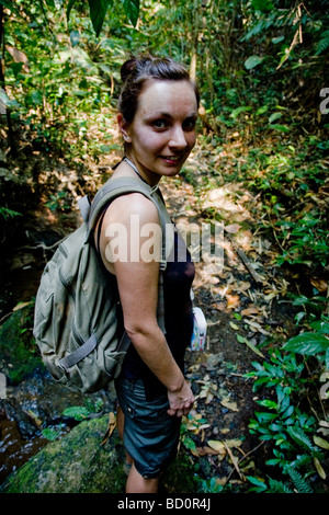 Asian woman hiking in jungle Stock Photo - Alamy