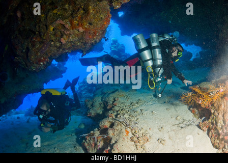 Technical divers swimming in the cave in Red Sea. Safaga, Red Sea Stock Photo