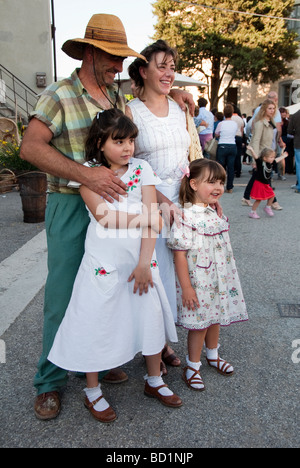 Family in vintage clothing of a typical Tuscan farmers from the 1950s Stock Photo