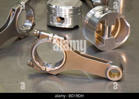 Brand new Conrod and pistons ready for engine assembly in a high performance modified car engine Stock Photo