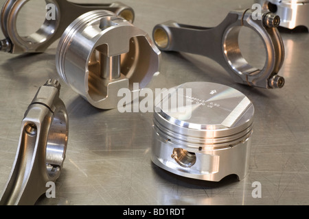 Brand new pistons with conrods ready for engine assembly in a high performance modified car engine Stock Photo