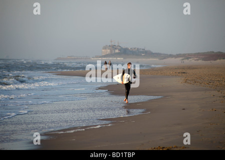 surfer at the baltic beach in De Haan Belgium Stock Photo