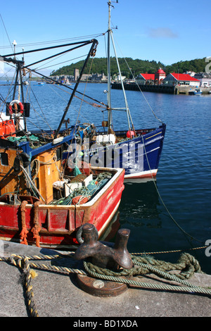 Fishing boats moored in Oban harbour, Argyll and Bute, West coast of Scotland - looking from South pier across to the North pier Stock Photo