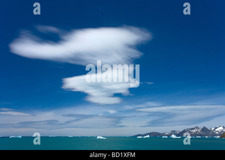 Icebergs and lenticular clouds near Gold Harbour South Georgia Antarctica Stock Photo