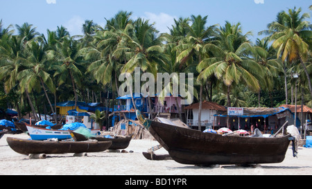 Bungalows and coco huts among palm trees on popular Palolem beach Goa India Stock Photo