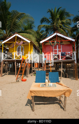 Cocohuts beach holiday bungalows on stilts Agonda beach Goa India Stock Photo