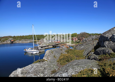 Sailboat moored at cliff in achipelago Stock Photo