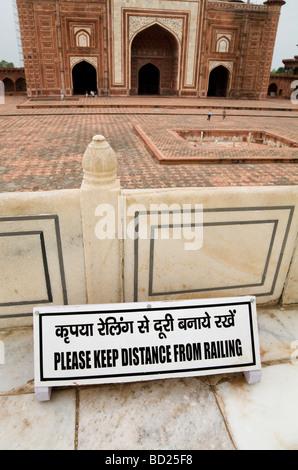 Sign saying Please Keep Away From The Railing at a balcony of the Taj Mahal. Agra. India. (The Jawab is the far building.) Stock Photo