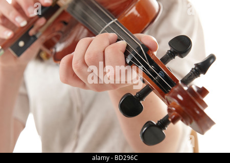 close up of girl playing the Viola against a white background Stock Photo