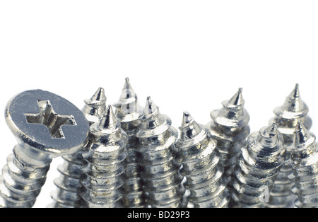 Close up of metal screw arranged on white background with copy space Stock Photo