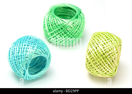 Three balls of nylon string arranged on white background Stock Photo