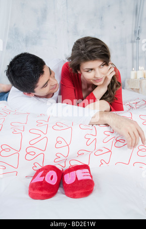 couple cuddling in bed Stock Photo