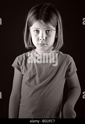 Powerful Shot of a Sad Looking Blonde Child Stock Photo