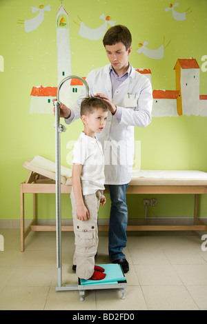 doctor measuring height of child Stock Photo
