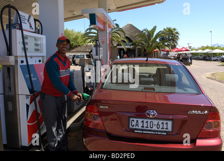 Garage attendant filling car with petrol, N2,Riversonderend, Overberg, Western Cape, South Africa, Africa. Stock Photo