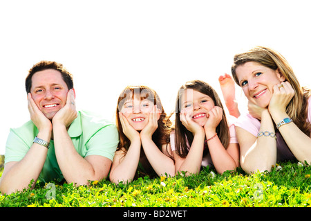 Portrait of happy family of four laying resting head on hands Stock Photo