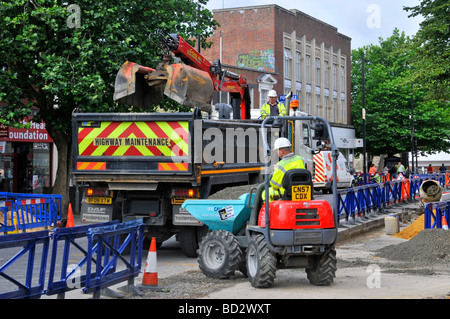 Street scene road works machines workmen & work in progress on ...