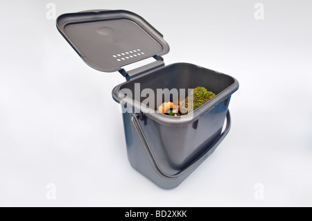 Kitchen compost caddy against white background Stock Photo