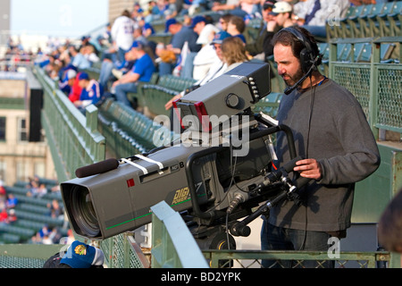 Television Cameraman at Cubs baseball game at Wrigley Field in Chicago Illlinois USA Stock Photo