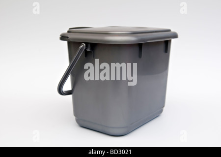 Kitchen compost caddy against white background Stock Photo