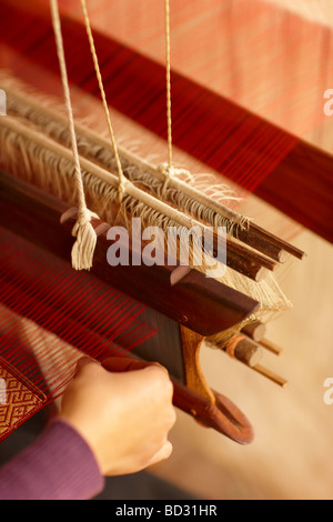 silk weaving, Luang Prabang, Laos Stock Photo