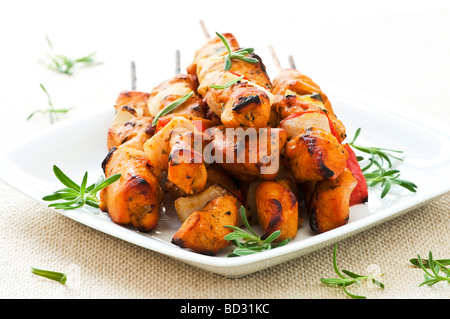 Pile of barbecued chicken kebab appetizers on a plate Stock Photo