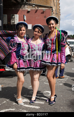 Three young Bolivian women in hats with traditional cloths in Tiataco ...