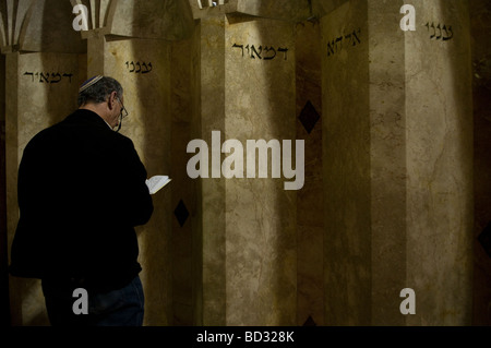 Religious Jewish man praying at the synagogue inside the Tomb of Rabbi Meir Baal Hanes in Tiberias Galilee Northern Israel Stock Photo