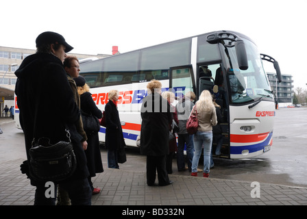 Queue for a long distance coach of the kind seem throughout Europe. Tallinn Coach Station, Estonia. Stock Photo