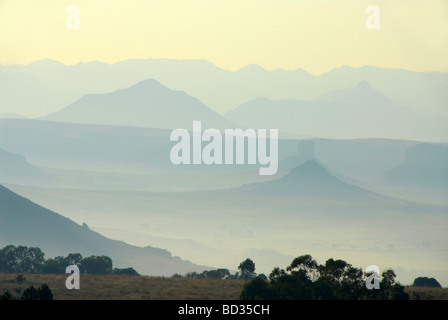 Hazy blue mountains on the border between South Africa and Lesotho, in Africa. These are part of the Maluti mountains Stock Photo