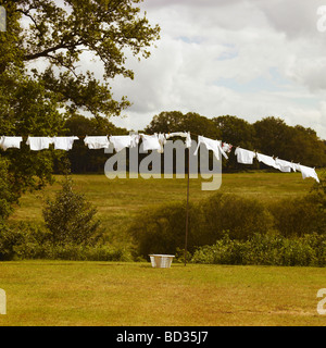 Family Washing Line with White Laundry . Stock Photo