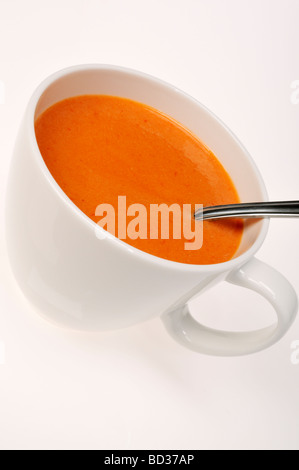 Cup of tomato soup with spoon Stock Photo